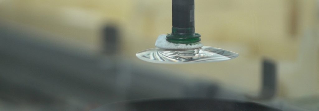 Lens manufacturing in a modern optical lab managed by optical lab management software