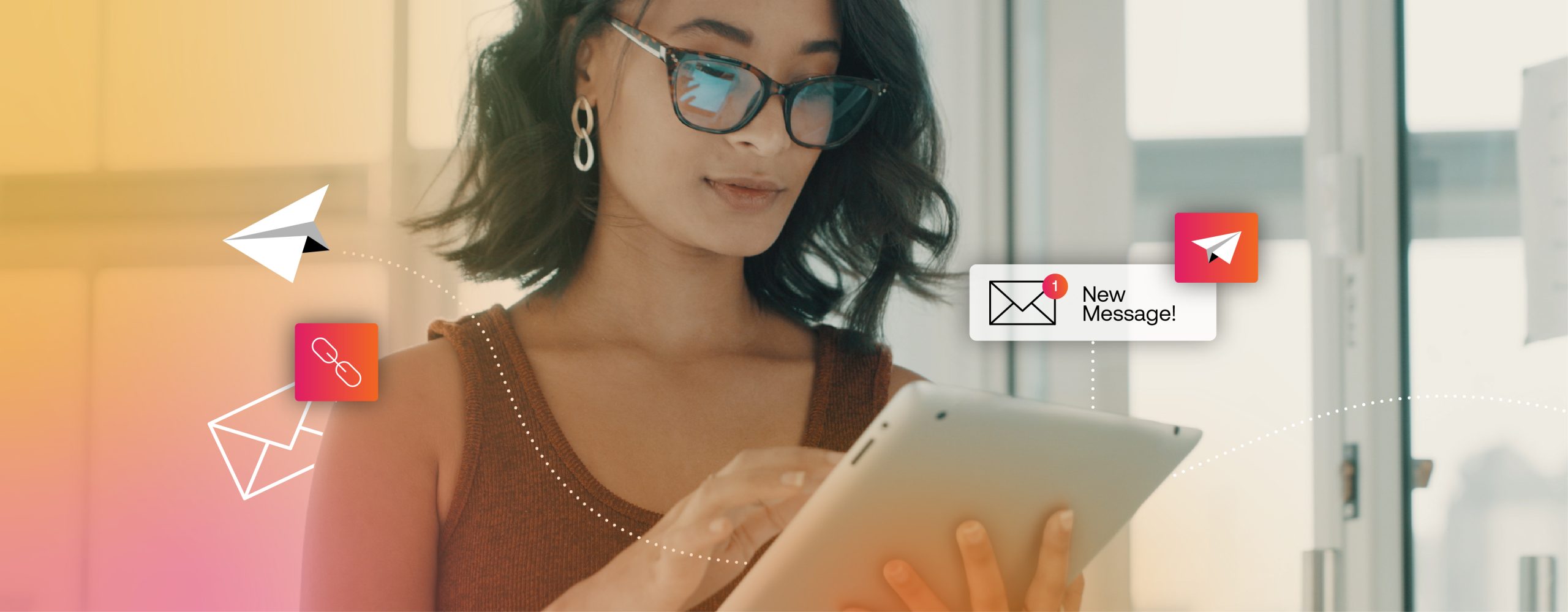 Woman with short dark hair and glasses using a tablet, with digital icons of envelopes and paper planes representing email marketing automation for opticians.
